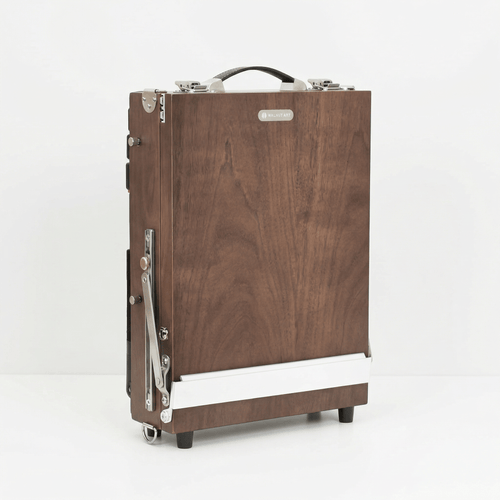 Wooden suitcase with metal accents on a white background