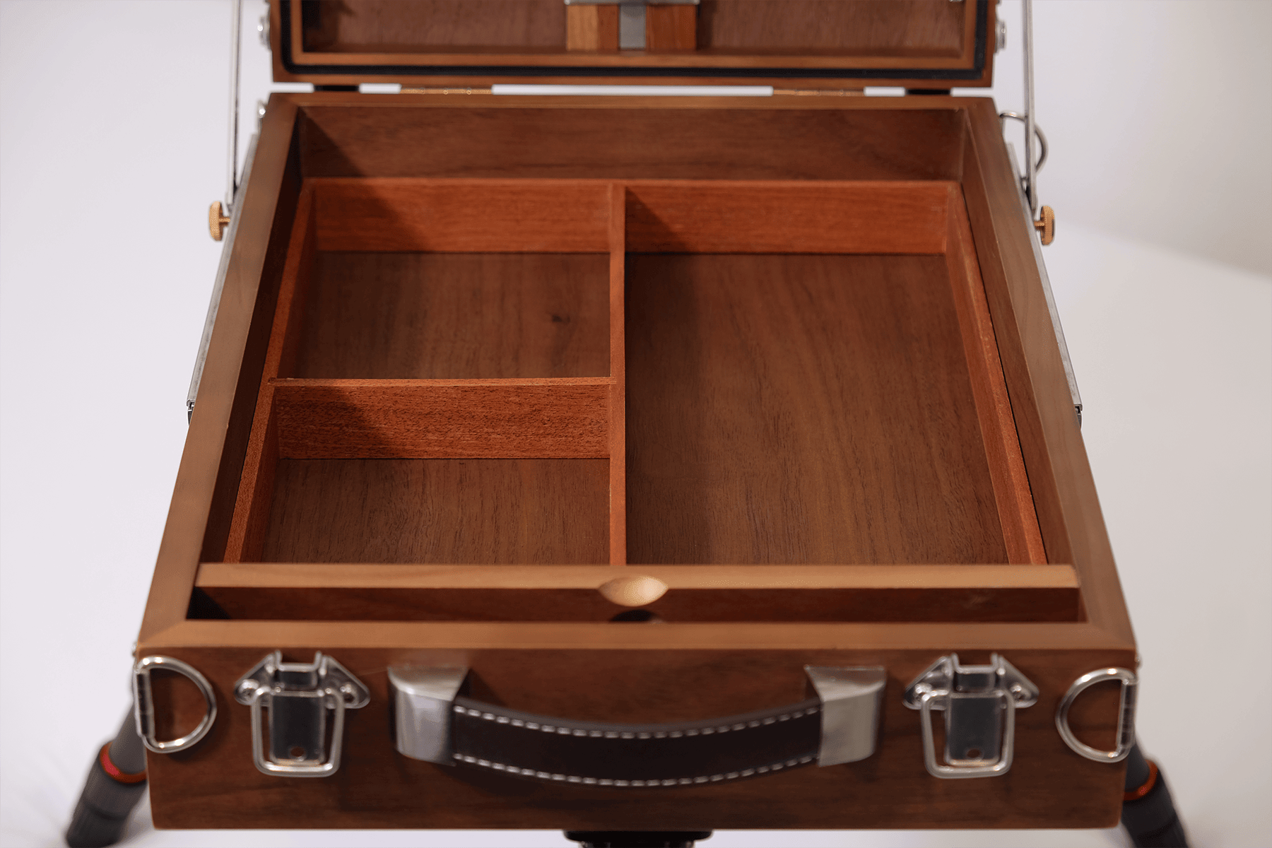 Wooden easel box with compartments on a white background