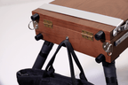 Wooden box with a weight hook on a stand with a white background